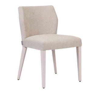 A white chair with a light colored upholstered back