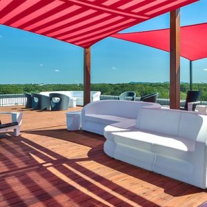 A white couch sitting on top of a wooden floor