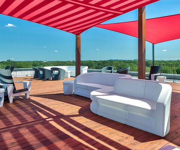 A white couch sitting on top of a wooden floor