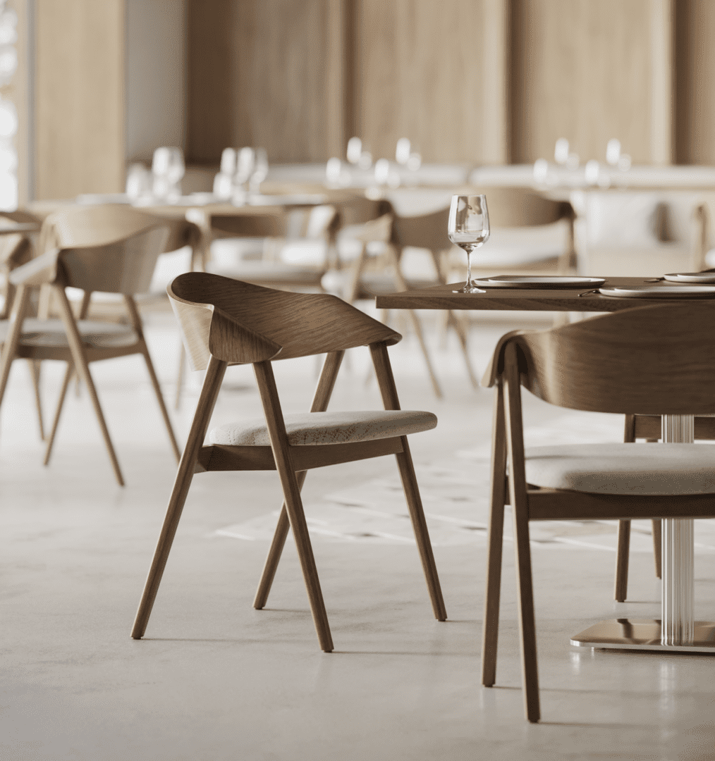 Dina Arm wood dining chair with upholstered seat showcased in a refined restaurant interior designed for hospitality and commercial dining environments.