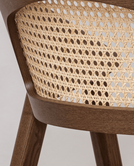 Detailed view of the Dina Arm USW dining chair highlighting woven wicker craftsmanship, premium wood construction, and hospitality-grade design.