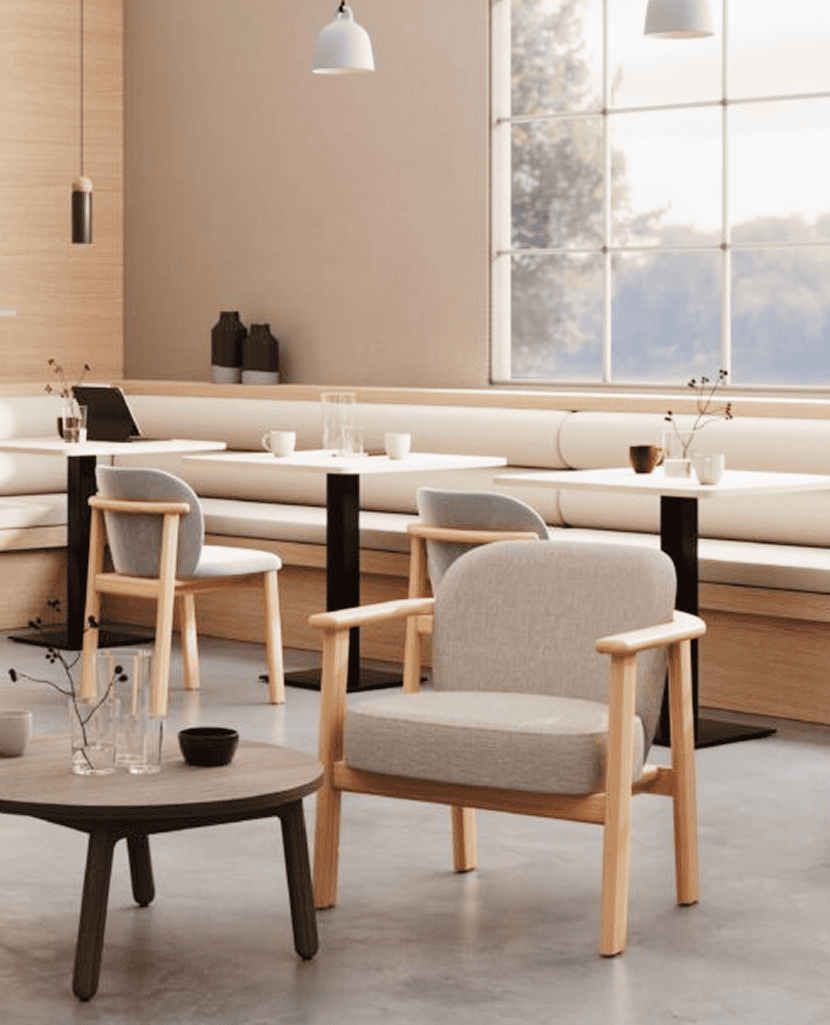 Solid-wood senior living dining armchair with fully upholstered back and seat and supportive armrests, custom-made in Canada by KECA for care residences.