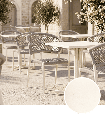 KECA metal chair in a timeless Beige powder-coat finish alongside linen and soft textiles, showing a warm neutral option for commercial seating.