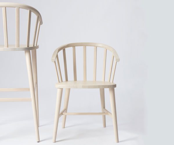 A white chair next to a white chair on a white background