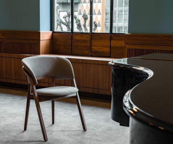 A chair and a piano in a room