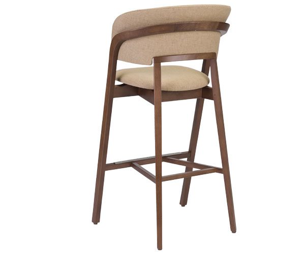 A wooden bar stool with a beige upholstered seat