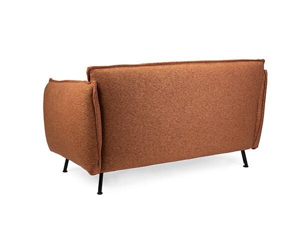 an orange love seat with black legs on a white background