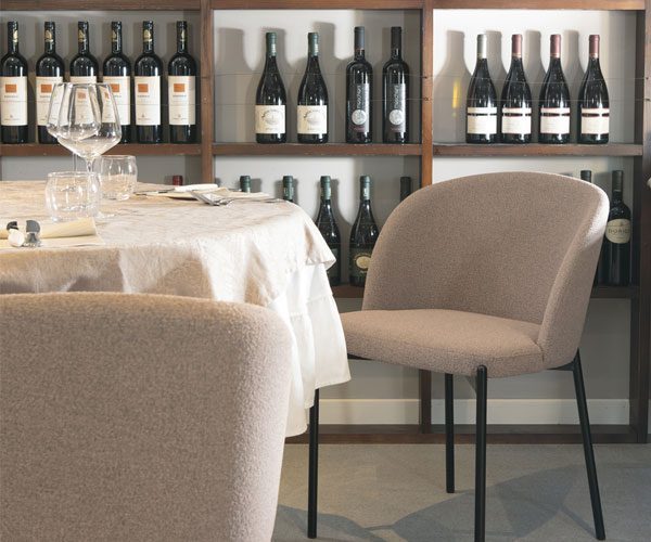 A couple of chairs that are sitting in front of a table