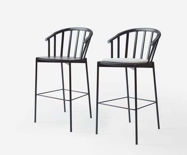 A pair of black bar stools with arms