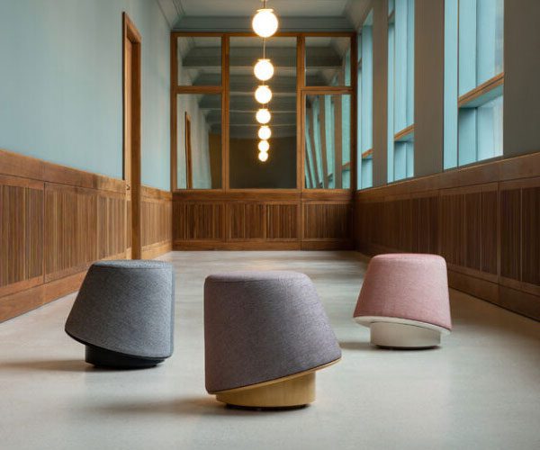 Three different colored lamps in a large room