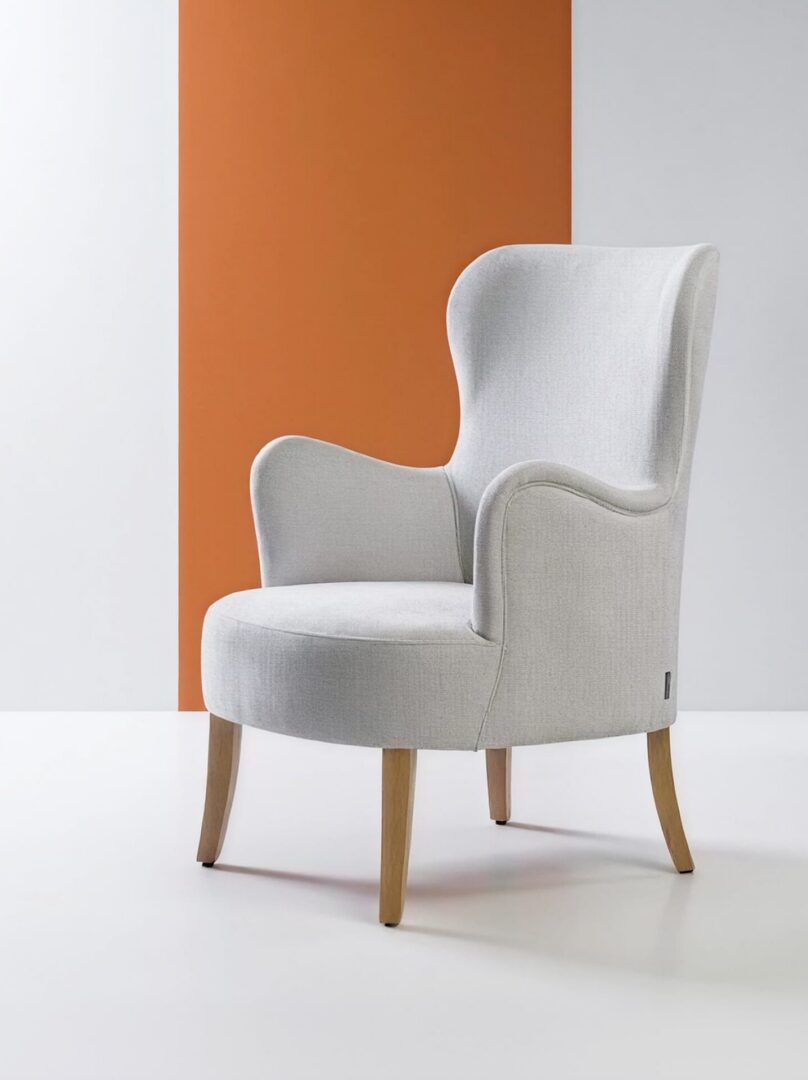 Commercial lounge armchair and pouf in a hotel lobby lounge, stylish durable seating for bars and restaurants by KECA.