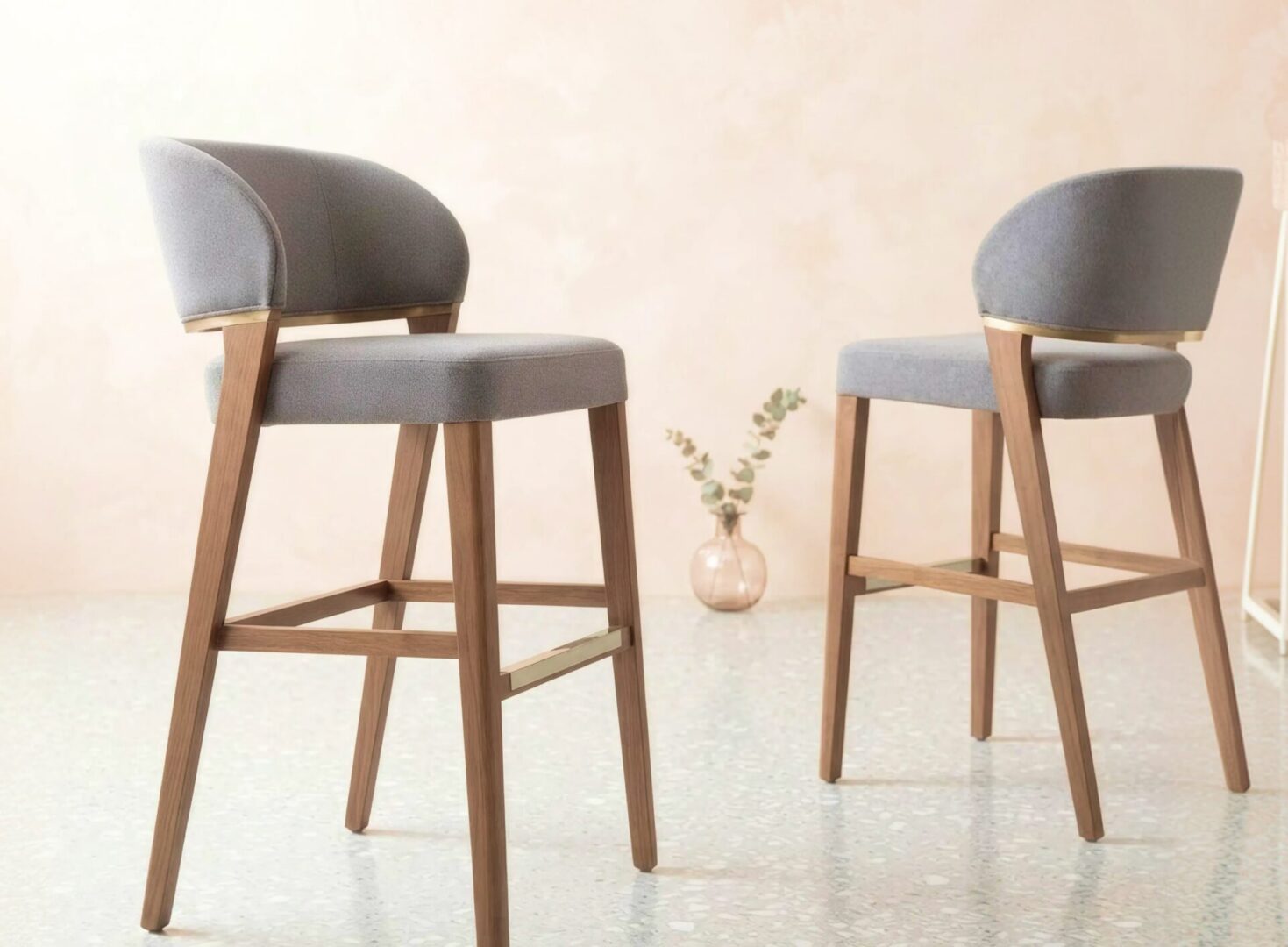 Commercial wood barstool with upholstered seat and backrest, offering counter- and bar-height seating for restaurants, bars and cafés by KECA.
